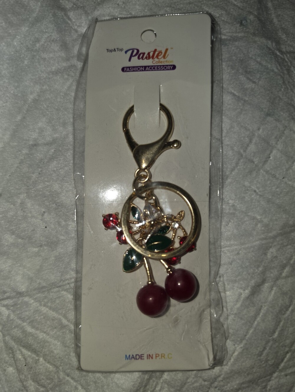 Gold-tone Cherry Keychain with Red Accents